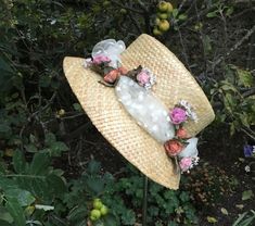 James Egleton Straw Hat.  Size 57cm-57.5cm  Polkadot tulle band with floral sprays in pinks, orange and cream hues.  Packed with vintage charm. Natural imperfections in the straw with small breaks consistent  with age and use. In lovely clean condition overall.  Please check your head measurement before you buy! If you need advice on how best to measure your head, please get in touch. Shipping:  I combine postage. I post U.K. 1st class signed for / international tracked and signed.  I will refun Handmade Vintage Hat Bands For Spring, Whimsical Spring Hats For Garden Party, Adjustable Brimmed Top Hat For Garden Party, Whimsical Hats With Handmade Flowers For Garden Party, Whimsical Mini Hats With Handmade Flowers For Summer, Handmade Mini Hats For Garden Party, Vintage Straw Hat For Spring Country Events, Vintage Sun Hat For Spring Country Events, Vintage Sun Hat For Country Events In Spring