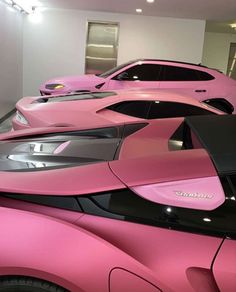 pink cars are lined up in a row