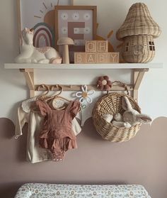 a baby's room with toys hanging on the wall