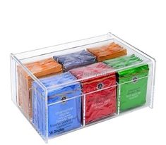 six different colored tea bags in a clear box