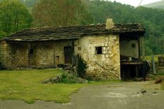 an old run down house in the mountains