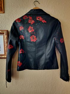 "Poppies" is a super soft faux-leather upcycled jacket.  Colors may vary slightly from pictures. Do you have an idea; a song, poem, etc that you would like to turn into a wearable piece of art? Send me a message and we can work together to make it come to life. Upcycle Faux Leather Jacket, Funky Leather Jackets, Leather Jacket Painting Ideas, Leather Jacket Upcycle, Leather Jacket Painting, Hand Painted Leather Jacket, Embroidered Leather Jacket, Painted Leather Jacket, Upcycled Jackets