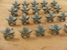 many small blue stars on a wooden table