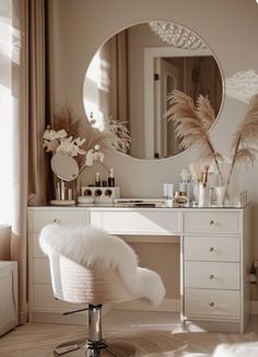 a white vanity with a mirror, stool and flowers