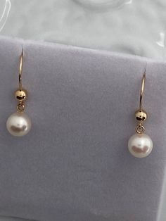 These gorgeous pearls were found in a diverse collection of pearls at an estate auction of a jeweler whose business was in Florida. These have a gorgeous, lush nacre. The hardware is all 14k gold filled. The lever backs are USA made.  You can always ask for a different earring mount. a. lever back.  b. long custom hook  c. short custom hook.  ALL 14k gold filled. Formal 14k Gold Filled Earrings With Pearl Charm, Classic 14k Gold Filled Pearl Earrings, Classic High Luster Drop Earrings, Classic Pearl Earrings With High Luster, Formal White Pearl Earrings 14k Gold Filled, Classic High Luster Pearl Earrings, Classic 14k Gold Filled Earrings With Pearl Charm, High Luster Akoya Pearl Earrings As Gift, Formal Round Pearl Earrings With Ear Wire