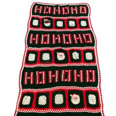 a black and red afghan with white squares