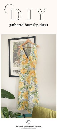 a dress hanging on the wall next to a plant and a framed photograph with text that reads, diy gathered bust slip dress