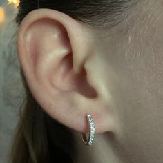 Our Hoop Earrings. Crafted with sterling silver, our silver hoop earrings feature cubic zirconia stones for that extra sparkle. These are a staple piece, and an easy everyday option! ✦Metal: 925 Sterling Silver ✦Plating: Rhodium ✦Size: 12mm x 2mm ✦Latch Back ✦Nickel Free ➳We guarantee our jewelry is highly durable & long lasting! ♡ ➳$1 Shipping On All Orders or FREE SHIPPING when you spend $35 or more at our shop! ♡ ➳USPS Ground Advantage 2-5 Day Shipping! ♡ ➳All packages insured up to $100! ♡ ➳ Cubic Zirconia Huggie Hoop Earrings With Ear Wire, Sparkling Small Hoop Huggie Earrings For Anniversary, Anniversary Sterling Silver Huggie Earrings With Sparkling Stones, Anniversary Small Hoop Earrings With Sparkling Stones, Sparkling Hoop Huggie Earrings As Gift, Small Hoop Earrings With Sparkling Stones For Anniversary, Sterling Silver Small Hoop Diamond Earrings, Sparkling Hoop Huggie Earrings For Anniversary, Silver Hoop Diamond Earrings For Everyday