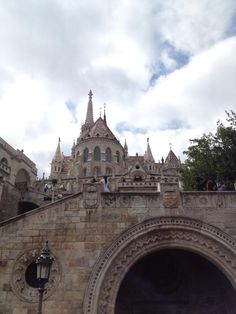 people are standing on the top of an old building