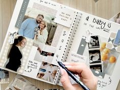 a person is holding a pen and looking at a scrapbook with pictures on it