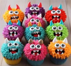 colorful cupcakes with monster faces on them