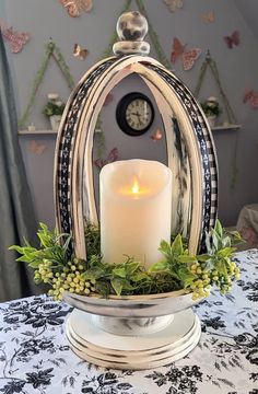 a lit candle sitting on top of a table