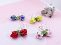 hand-sculpted roses hanging upside down with nickel-free metalware Dangle Rose Design Flower Earrings For Gift, Gift Rose Design Dangle Earrings, Pink Dangle Jewelry With Rose Design, Handmade Rose Drop Earrings, Handmade Rose Dangle Earrings, Pink Rose Design Dangle Earrings, Pink Dangle Flower Charm Earrings, Hanging Upside Down, Beautiful Scenery Nature