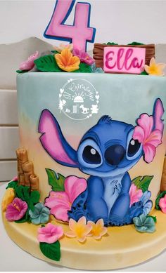 the birthday cake is decorated with an image of stitchy from lilpui and flowers