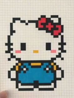 the hello kitty cross stitch pattern is being held up by someone's hand,