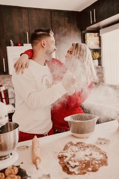 a man and woman are in the kitchen cooking some food with steam coming out of their mouths