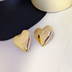 Get ready to swoon over the Soulmate Large Bubble Heart Earrings. These studs have a post backing and shiny, gold finish. Luxe, lightweight and perfect for making a statement with your next look.


Material: Gold-plated brass
Studs with post backing
Dimensions: 1.5" x 1.5"
Bubble heart shape Bubble Heart, Metal Heart, Christmas Earrings, Earring Sale, Ear Jewelry, Heart Earrings, Heart Design, Heart Shape, Get Ready