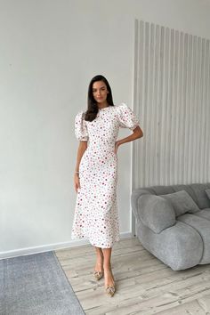 A delicate midi-length dress with the most feminine "godet" silhouette skirt and an adorable floral print in milk. The garment has a fitted cut and puffy sleeves. The dress favorably emphasizes the silhouette, tightly fitting the hips, expanding to the bottom. The dress will make you feel beautiful and good looking. Modest Midi-length Puff Sleeve Dress With Gathered Sleeves, Summer Midi-length Puff Sleeve Dress With Buttons, Luxury Floral Print Midi Length Puff Sleeve Dress, Elegant Midi-length Puff Sleeve Dress With Floral Print, Luxury Floral Print Midi Puff Sleeve Dress, Puffy Sleeves, Midi Length Dress, Printed Midi Dress, How To Feel Beautiful