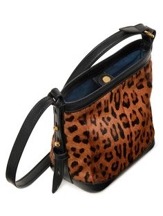 A classic small shoulder bag in leopard-print hair with smooth vegetable-tanned leather trim Leopard print long-hair goat leather with smooth vegetable-tanned leather trim Bonded microsuede lining Brushed gold-tone hardware Adjustable shoulder strap can be worn crossbody (50-57cm drop) Snap button closure Can fit a small wallet, large phone and other essentials Made-in-Italy 17 cm length x 10 cm depth x 18 cm height Luxury Calf Hair Shoulder Bag For Daily Use, Luxury Shoulder Bag With Leather Handles And Calf Hair, Designer Leather Bags In Leopard Print, Chic Tortoiseshell Leather Bag, Leather Shoulder Bag With Leopard Print And Leather Handles, Designer Leopard Print Bag For Everyday Use, Calf Hair Satchel Bag, Luxury Calf Hair Satchel Bag, Luxury Leopard Print Bags For Formal Events