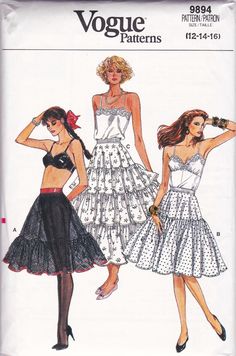 two women's dresses, one in white and the other in black