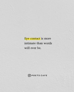 a white wall with a quote on it that says eye contact is more intimate than words will ever be