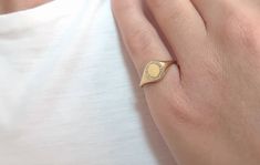 This small solid gold frame ring is set with diamonds! You can write your favorite letter as all letters are available ( or numbers) and create your personalized signet ring. The possibilities to engrave it are endless, your initials, your beloved s initials, your kids, etc. ✔ Made to Order ✔ Gold Kt: 9k-14K-18k ✔ Available Gold Color: Rose Gold, Yellow Gold, White Gold ✔ Gemstone: Genuine Diamonds, or other genuine gemstones ✔ Stone Cut: Round ✔ Number of Stones: 20 ✔ Setting Type: Micropave ✔ Elegant Signet Ring With Halo Setting As Gift, Elegant Signet Ring With Halo Setting For Gift, Gold Diamond Signet Ring Personalized, Gold Diamond Personalized Signet Ring, Dainty Gold Diamond Signet Ring, Elegant Everyday Diamond Signet Ring, Elegant Everyday Diamond Initial Ring, Gold Oval Signet Ring With Diamond Accents, Everyday Diamond Oval Signet Ring