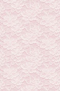 a pink wallpaper with white lace on it