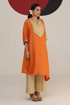 Rust orange asymmetric kaftan with a woven yoke with tassel details. Paired with a pant and inner. - Aza Fashions Traditional Designer Kurta With Back Tassel Tie-up, Festive Straight Kurta With Back Tassel Tie-up, Straight Kurta With Back Tassel Tie-up For Eid, Eid Straight Kurta With Back Tassel Tie-up, Orange Bohemian Set For Eid, Bohemian Orange Sets For Eid, Bohemian Orange Set For Eid, Traditional Kurta With Back Tassel Tie-up For Diwali, Orange Designer Dresses