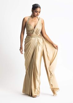 Nitika Gujral-Gold Satin Draped Sari And Blouse-INDIASPOPUP.COM Hot Blouses For Saree, Gold Satin Saree, Halter Neck Saree, Sangeet Saree, Halter Neck Blouse Design, Draped Sarees, Golden Lehenga, Golden Blouse, Saree Jackets