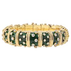 Tiffany & Co. Schlumberger 18K Yellow Gold Deep Bright Green Enamel And Diamond Bracelet. An exquisite creation, a dark green paillonne enamel hinged bangle by Jean Schlumberger that encapsulates the brilliance of design and craftsmanship. This bangle is adorned with collet-set diamonds, each sparkling with its unique radiance, while sculpted 18k gold vertical bands add a touch of luxury. A marriage of artistry and elegance, this piece is signed Schlumberger for the renowned Jean Schlumberger an Jean Schlumberger, Modern Bangle, Yellow Jewelry, French Jewelry, Enamel Bangle, Diamond Bangles Bracelet, Diamond Bangle, Green Enamel, Hinged Bangle