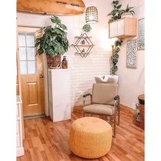 a living room filled with furniture and plants