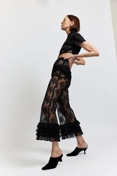 In need of the perfect post-beach dinner pants? Keep it cool with the Ruffle Pant in Black Lace from Batsheva. These NYC made pants are perfect for that summer beach vacay. Ruffled Wide Leg Pants For Evening, Wide Leg Ruffled Pants For Evening, Evening Wide Leg Ruffled Pants, Evening Wide Leg Pants With Ruffles, Evening Wide-leg Ruffled Pants, Summer Evening High-waisted Wide Leg Pants, Chic High-waist Summer Parachute Pants, Beach Wide Leg Bottoms With Ruffles, Black Ruffled Bottoms For Vacation