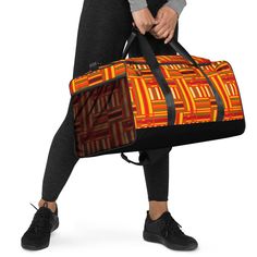 This African print travel duffle gym bag is the perfect way to add a touch of African culture to your fitness routine! The vibrant colors and African design of this bag will have you making a statement wherever you go. This bag features a large main compartment and plenty of pockets, including one with a zipper to keep all your gym gear organized. It's made with durable fabric and a reinforced base, so it can handle any adventure you take it on. With its adjustable padded shoulder straps and comfortable handles, it's easy to carry and perfect for traveling. Get ready to make a statement with this stylish and functional African print travel duffle gym bag! This duffle bag is the perfect companion for every occasion--take it with you when traveling, running daily errands, or going to the gym Rectangular Weekender Bag With Luggage Sleeve For Gym, Functional Orange Sports Bag, Rectangular Travel Bag With Luggage Sleeve For Gym, Sports Rectangular Gym Bag With Luggage Sleeve, Gym Gear, Travel Duffle, Duffel Bags, Travel Duffel, Duffel Bag Travel