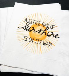 two napkins with the words, at the ray of sunshine is on it's way