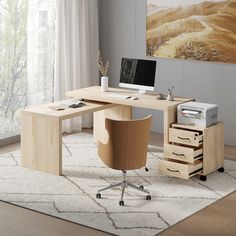 an office desk with drawers and a computer on it