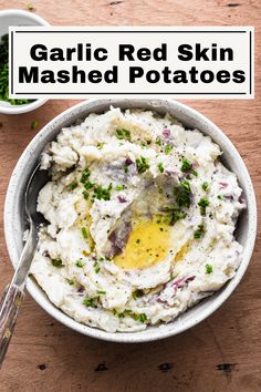 a bowl filled with mashed potatoes topped with an egg and parsley on top