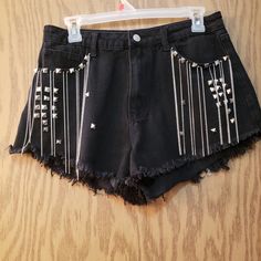 Very Cute Black Jean Shorts With Silver Chain Fringe And Stud Details. Size Large. Never Worn. Perfect For Concerts. Edgy Festival Shorts, Summer Grunge Style Bottoms For Concerts, Grunge Style Summer Concert Bottoms, Black Casual Bottoms For Music Festival, Summer Gothic Club Bottoms, Trendy High Waist Shorts For Alternative Fashion, Trendy High-waist Shorts For Alternative Fashion, Edgy High Waist Shorts For Alternative Fashion, Summer Punk Style Club Bottoms