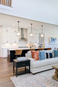 Equipped to entertain the Kendall's kitchen boasts a large island, cabinets that reach all the way to the ceiling, and pendant lights that perfectly complement this two-toned kitchen. With three floors the Kendall will not disappoint. See this fabulous model at Weatherford Estates in Angier, North Carolina. black and white kitchen Island Cabinets, Two Tone Kitchen