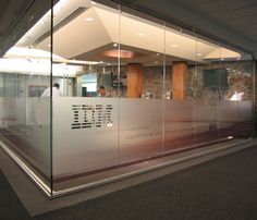 an empty office building with glass walls