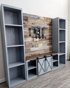 an entertainment center made out of wood and metal