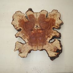 a piece of wood that has been cut in half and is sitting on the wall