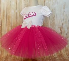 Barbie Birthday Tutu Outfit by Little Ladybug Tutus. Please check our website's home page for current turnaround time. Since all items are handmade at the time of purchase, there is a production time that varies. I hope my customers all understand that I am a one woman shop and create my items to surpass expectations. Every item ordered is handmade at the time of purchase. I also hope you understand that the wait is worth it! Shipping Information We offer FREE SHIPPING on all orders within the U Cute Pink Tutu Dress For Costume Party, Fun White Tutu Dress For Birthday, Pink Tutu Dress For Carnival Party, Pink Tutu Dress For Costume, White Fun Tutu Dress For Party, Whimsical Pink Tutu Dress For Costume, White Tutu Dress For Party, Pink Halloween Tutu Party Dress, White Tutu Dress For Easter Party