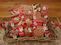 a basket filled with lots of presents on top of a white rug next to a wooden floor