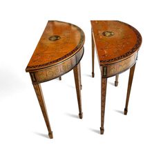 two wooden tables sitting next to each other