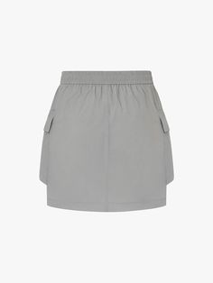 MO&Co. Women's Drawstring Detail Pocket Skirt Introducing our skirt - a must-have for any fashion-forward individual. Crafted from luxurious, comfortable fabric, this mini cargo silhouette features an elasticated waist with a drawstring for the perfect fit. The large patch pocket design adds functionality, making it a versatile piece for casual occasions. Pair with our coordinating cropped Jacket for a sophisticated, elevated look. Features : - Inclusive mini cargo silhouette- Elasticated waist with drawstring- Side large patch pocket design Code: MBD2SKT008The back length of size S is 38cmMATERIALS & CARE Material: 100% PolyamidePlease put it into a mesh bag to wash.REMINDER: All items are measured manually. Please note that it's reasonable that there might be minor measurement difference Patch Pocket Design, Pocket Skirt, Drawstring Detail, Cropped Jacket, Mesh Bag, Gray Skirt, Skirts With Pockets, Crop Jacket, Pocket Design