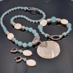 IDEAL FOR? ------- This set is made of natural aquamarine and mother of pearl   (necklace+bracelet+pendant+earrings) will suit your mom, sister, wife, best gift for birthday, anniversary, Valentine's Day, graduation, Mother's Day, etc., etc., etc., etc. . etc. etc. etc. -------This original modern designer set is ideal for both casual and business looks. ------- The set is assembled by hand - it is unique, has its own charm and emphasizes your individuality and beauty. Elegant Amazonite Jewelry Gift, Elegant Amazonite Jewelry For Gifts, Handmade Blue Mother Of Pearl Jewelry, Handmade Light Blue Aquamarine Jewelry, Elegant Blue Amazonite Jewelry, Elegant Handmade Larimar Jewelry, Elegant Turquoise Jewelry With Mother Of Pearl, Handmade White Larimar Jewelry, Elegant White Larimar Jewelry