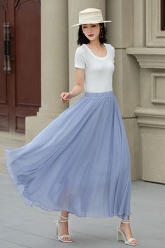 A trendy light blue A-line midi chiffon skirt, perfect for breezy summer days. The elastic waist ensures maximum comfort, making it a must-have for any fashionista. Elevate your summer wardrobe with this chic piece!  DETAILS: * Chiffon skirt * Polyester lining * No pockets * High-waisted cinched hem * Elasticized waist closure * Swing skirt * Mid-length skirt * A-line skirt * Suitable for spring, summer and fall wear * Machine washable in cold/warm water, do not bleach/medium iron/line dry * Suitable for daily wear/wedding/bridesmaid dresses/vacation/date night/graduation/party etc. CUSTOM MADE SERVICE If you * Change other color * Can't find your size in our size Chart * Change the Style * Change the length * Your Height is not Between 5'1" - 5"9" * Your weight is not Between 47 kg - 75kg Light Blue Full Skirt For Summer, Blue Full Maxi Skirt For Summer, Elegant Blue Maxi Skirt For Summer, Blue Flowy Skirt, Chiffon Midi Skirt For Spring, Spring Chiffon Flared Skirt, Light Blue Flowy Skirt For Summer, Light Blue Flared Skirt For Summer, Solid Chiffon Skirt For Spring