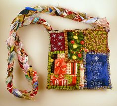 a multicolored purse with a ribbon around it