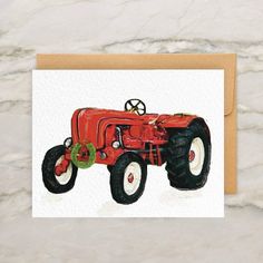 a card with an image of a red tractor