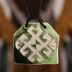 An intricate motif of mystic allure is gracefully embellished with green and white hues in Arpine Matevosyan's newest design. This ceramic pendant necklace with geometric details pays homage to Armenia's classic artistry and nature, all present in the elements composing the piece. The accessory also has a cotton cord. Ceramic Pendant Necklace, Hand Painted Necklace, Art Necklaces, Mens Jewelry Necklace, Ceramic Pendant, Green Ceramics, Geometric Necklace, Cotton Cord, Jewelry Packaging